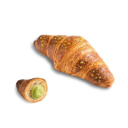 Goldenes Croissant mit Pistazienstreuseln, ein kleineres Stück aufgeschnitten zeigt die grüne Pistaziencreme.