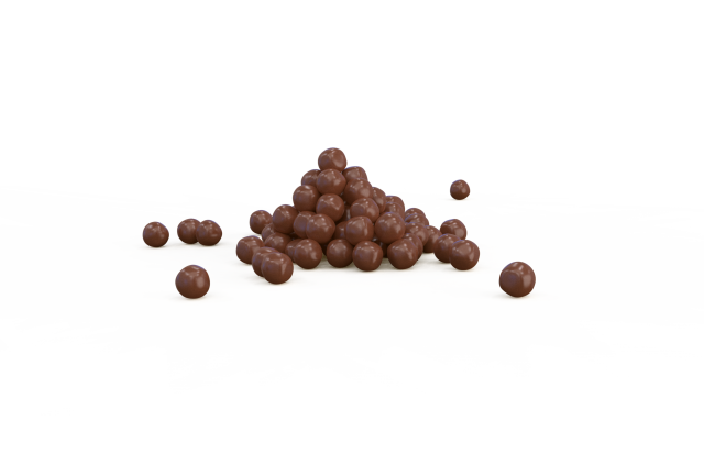 Pyramide aus runden Schokokugeln mit einigen verstreuten Stücken auf weißem Hintergrund.