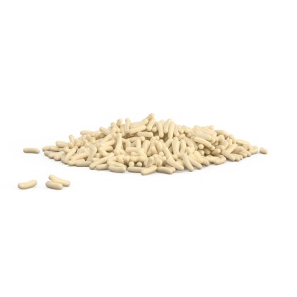 Kleiner Haufen cremefarbener zylindrischer Pellets auf weißem Hintergrund, mit einigen verstreuten Stücken daneben.